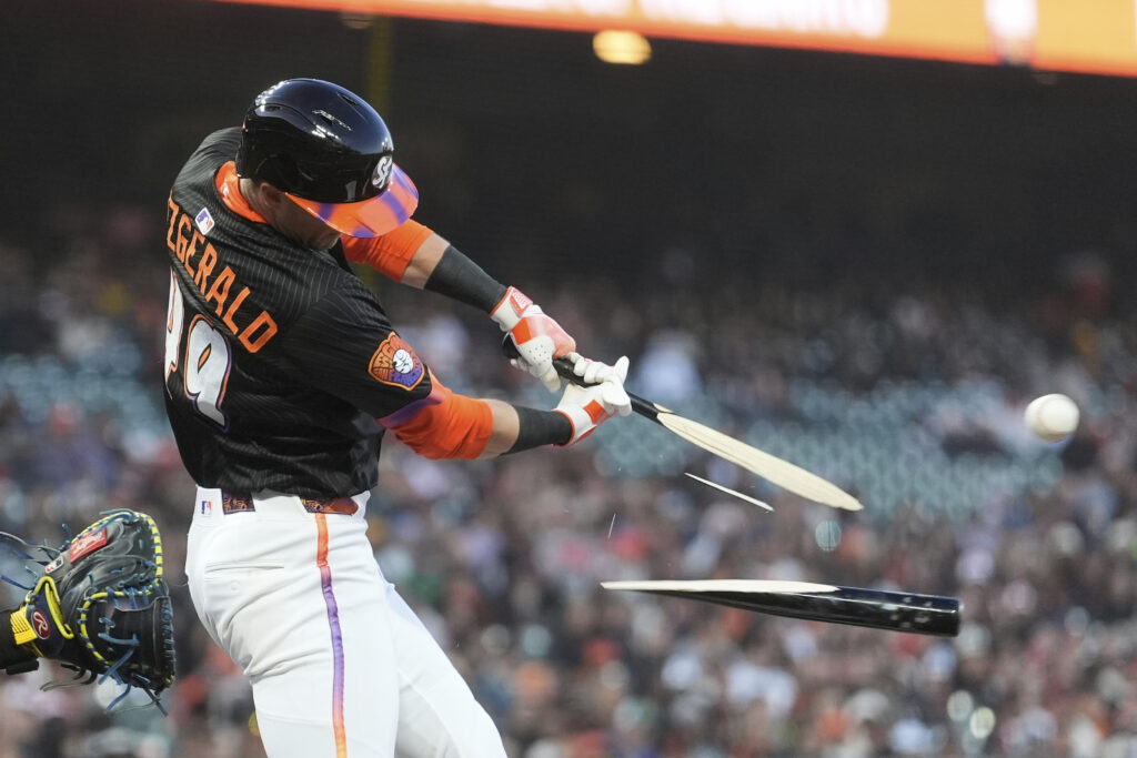 San Francisco Giants' Tyler Fitzgerald breaks his bat on an RBI single during the third inning of a baseball game against the Milwaukee Brewers in San Francisco, Tuesday, April 22, 2025.