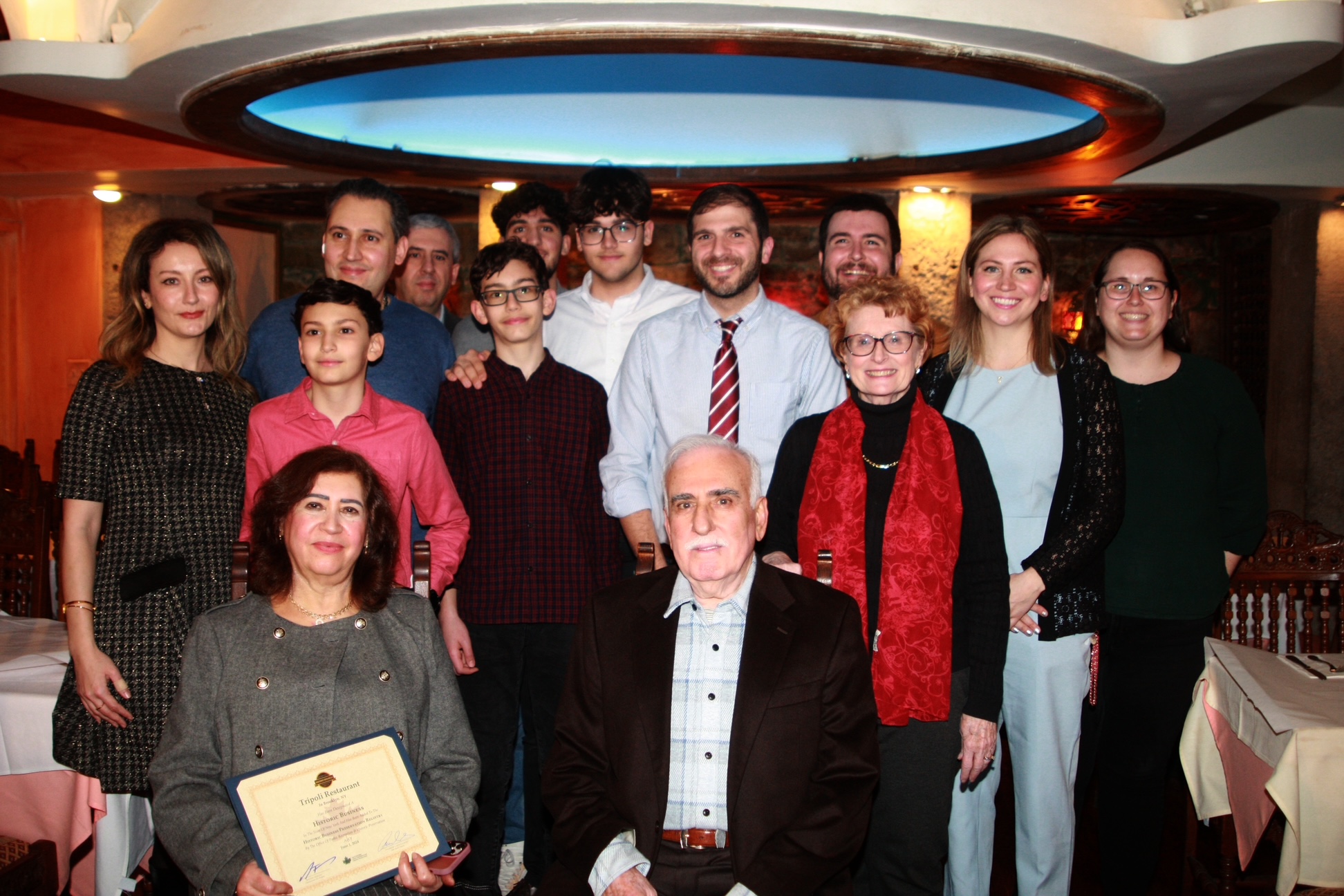 Tripoli owner Mohamad Salem (in blazer) alongside family members, elected officials, and Atlantic Avenue Business Improvement District Executive Director Kelly Carroll (second from right). Photo by Arthur De Gaeta