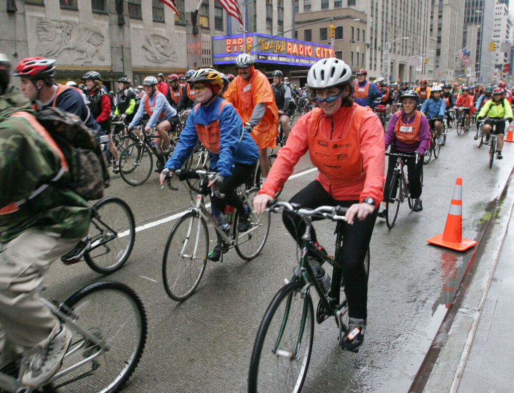 Radio City Music Hall is visible in the background as cyclists participating in Bike New York's Five Boro Bike Tour ride up New York's Sixth Avenue, Sunday May 1, 2005. The 42 mile bike tour traveled through the five boroughs of New York City. Photo: Tina Fineberg/AP