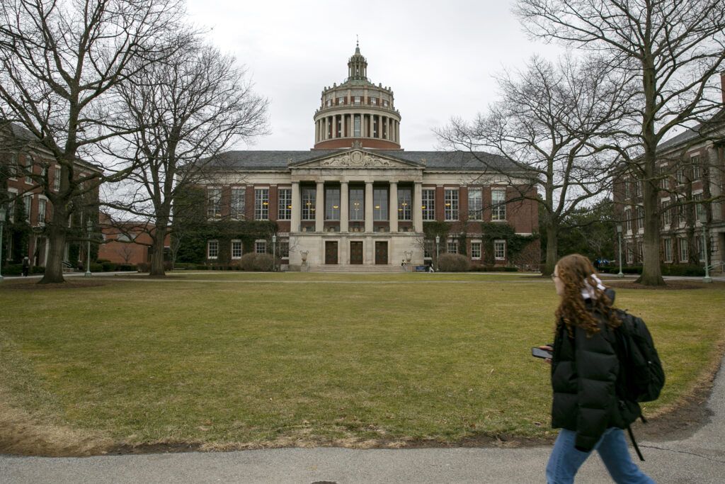 A student walks by the Rush Rhees Library at the University of Rochester, Feb. 22, 2023. AP Photo/Ted Shaffrey, File