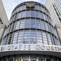 The seal of the United States is displayed on the facade of federal court in Brooklyn, Tuesday, Jan. 17, 2023, in New York. AP Photo/John Minchillo, File