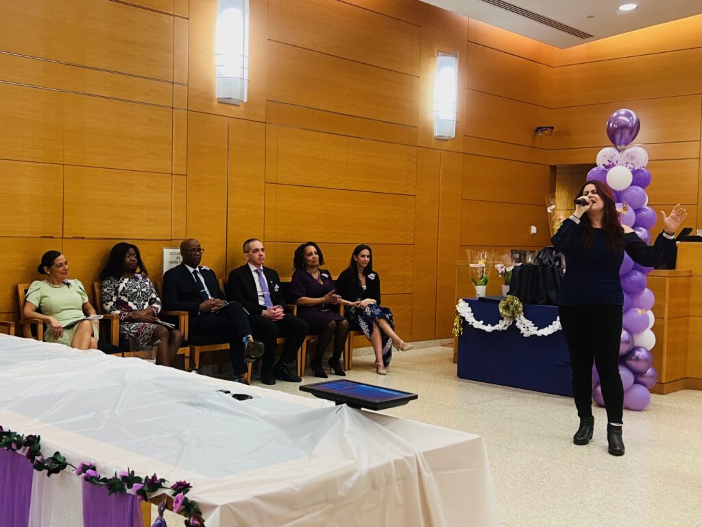Julia Veinblat, senior court clerk, performing a musical interlude. Brooklyn Eagle photos by Wayne Daren Schneiderman