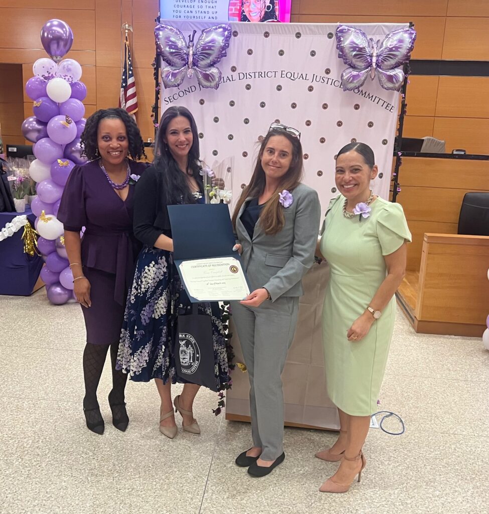 Gina Campbell, senior court clerk (second from right), accepting her Certificate of Recognition. Brooklyn Eagle photos by Wayne Daren Schneiderman