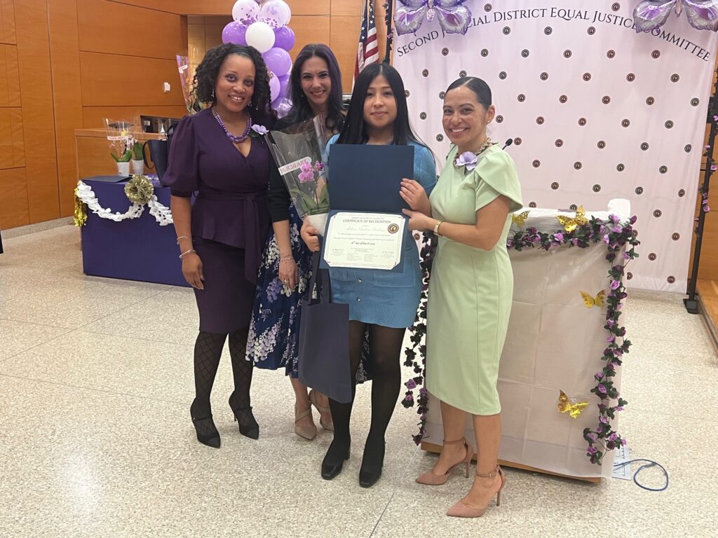 Melissa Canteno Cardenas, secretary (second from right), accepting her Certificate of Recognition. Brooklyn Eagle photos by Wayne Daren Schneiderman