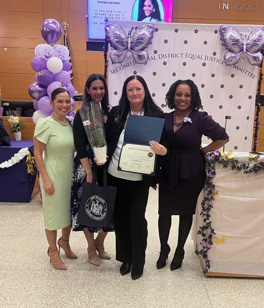 Helen Levine, senior court clerk (second from right), accepting her Certificate of Recognition. Brooklyn Eagle photos by Wayne Daren Schneiderman