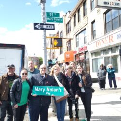 Family and friends gather at the corner of Fourth Avenue and 95th Street with the sign dedicated to Mary Nolan. Photo by Arthur De Gaeta