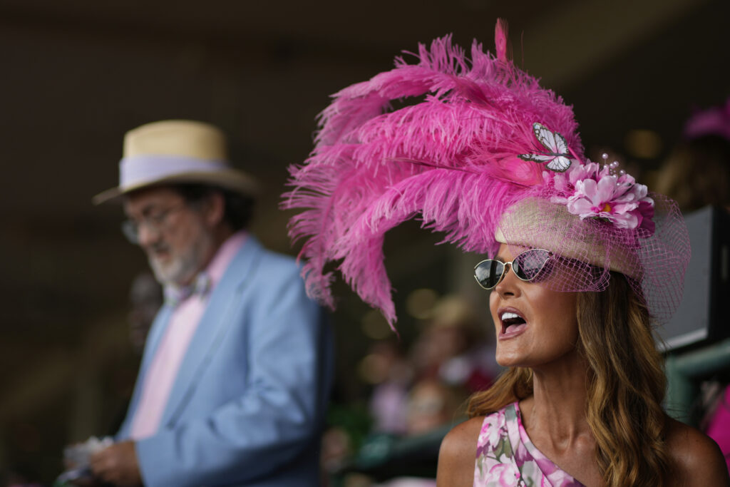 A race fan sits in the stands at Churchill Downs before the 151st running of the Kentucky Oaks horse race Friday, May 2, 2025, in Louisville, Ky.