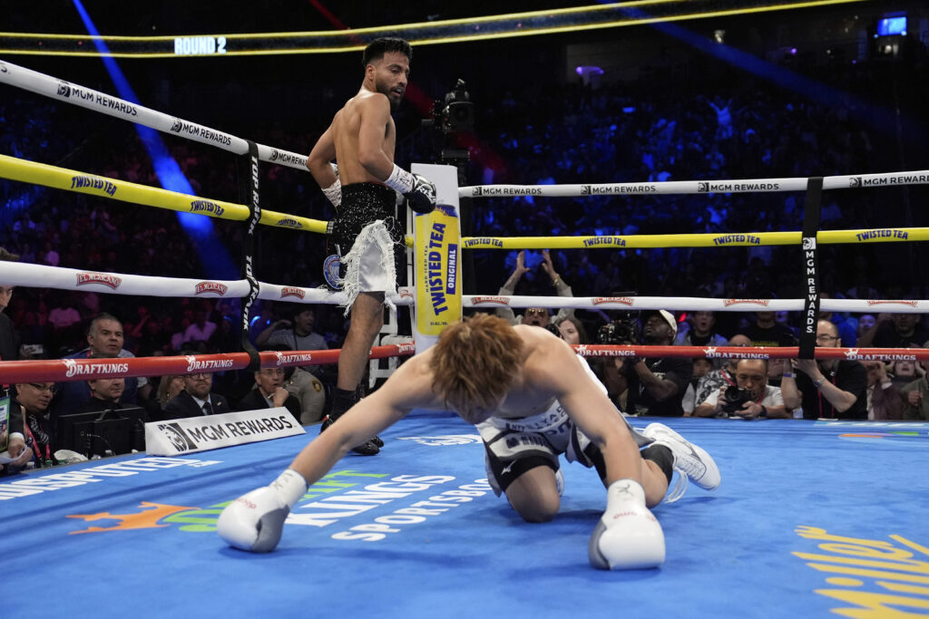 Ramon Cardenas knocks down Naoya Inoue in a junior featherweight title boxing match Sunday, May 4, 2025, in Las Vegas.