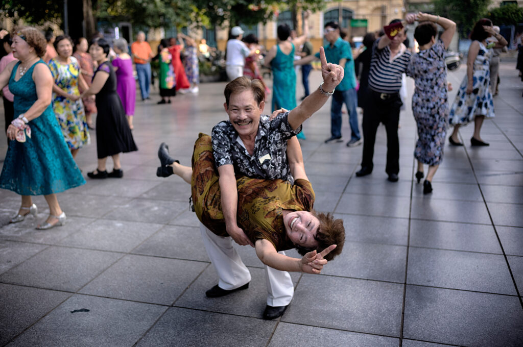 A Vietnamese couple practice Ballroom dancing as part of their morning exercise along Hoan Kiem Lake in Hanoi, Vietnam on Friday, May 2, 2025.