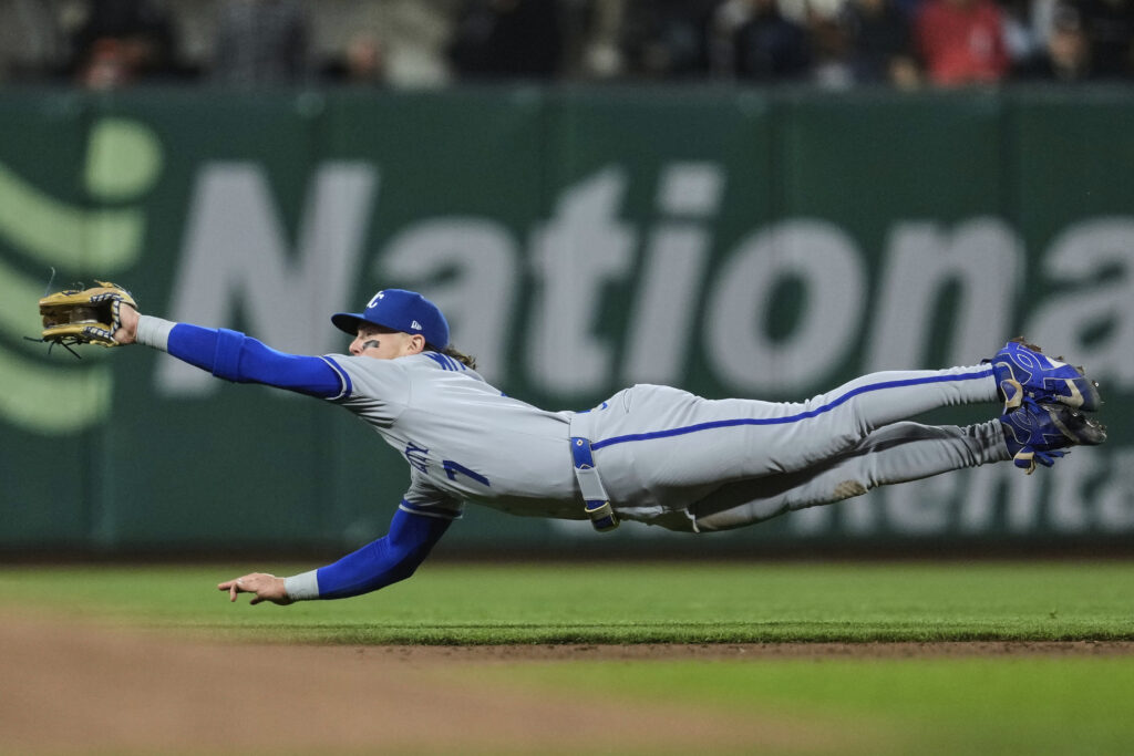 Kansas City Royals shortstop Bobby Witt Jr. dives to catch a ball hit by San Francisco Giants' Patrick Bailey for an out during the sixth inning of a baseball game Tuesday, May 20, 2025, in San Francisco.