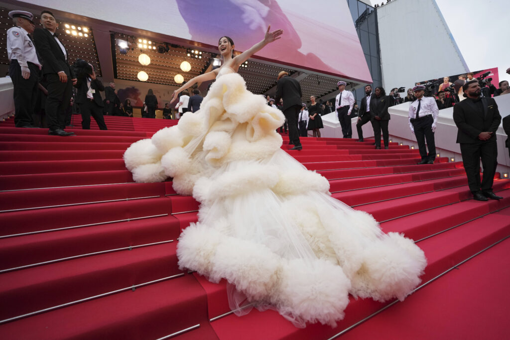 Wan QianHui poses for photographers during the opening ceremony red carpet of the 78th international film festival, Cannes, southern France, Tuesday, May 13, 2025.