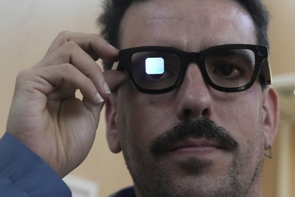 Michael Mcloughlin, of El Confidencial, gets a demonstration of Gemini on Android XR glasses at a Google I/O event in Mountain View, Calif.,