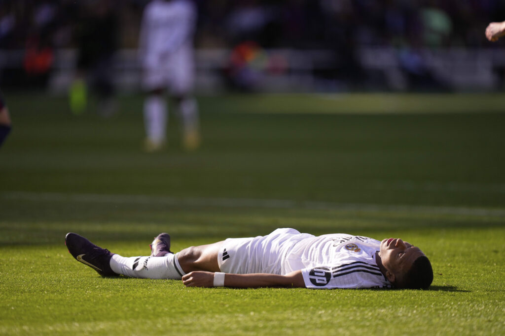 Real Madrid's Kylian Mbappe reacts after missing a chance to score during the Spanish La Liga soccer match between Barcelona and Real Madrid at the Lluis Companys Olympic Stadium in Barcelona, Spain, Sunday, May 11, 2025.