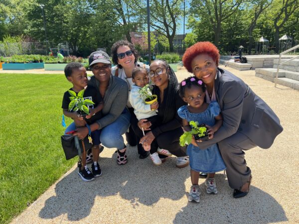 Family members with District 22 Superintendent Julia Bove and District 46 Councilmember Mercedes Narcisse who secured $500,000 in funding for the Learning Farm. Photo by Loretta Chin