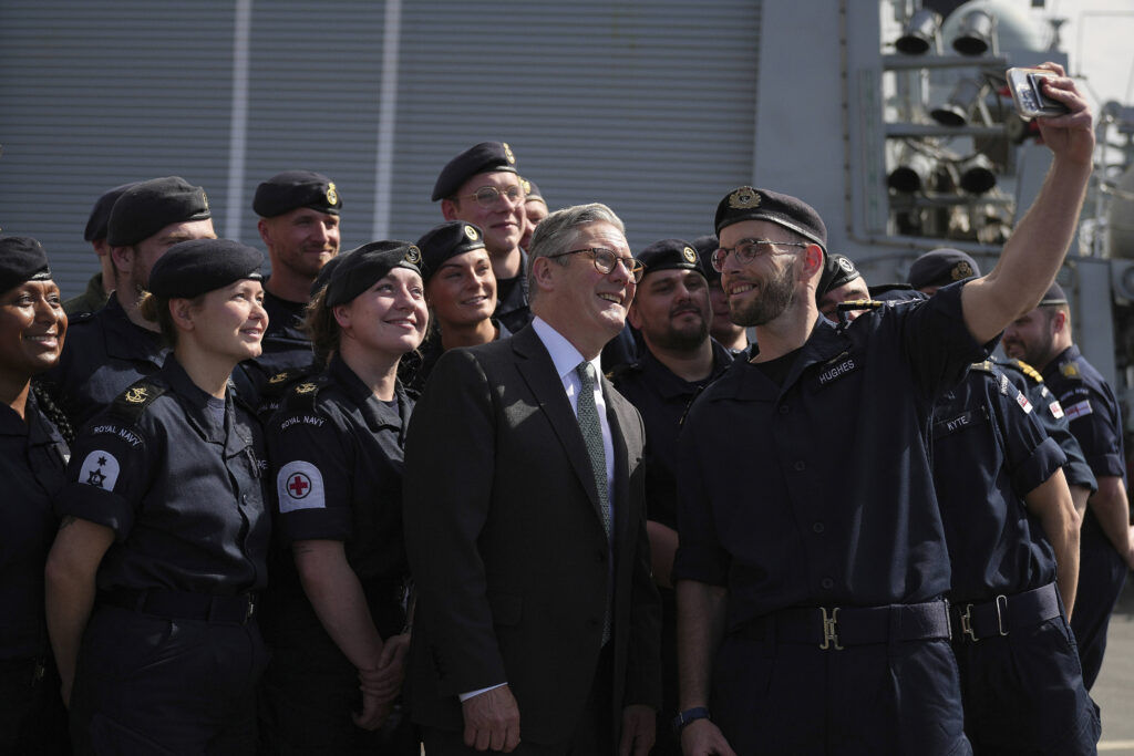 Britain's Prime Minister Keir Starmer poses for a picture with Royal Marines during his visit to Norway in Oslo, Friday, May 9, 2025.