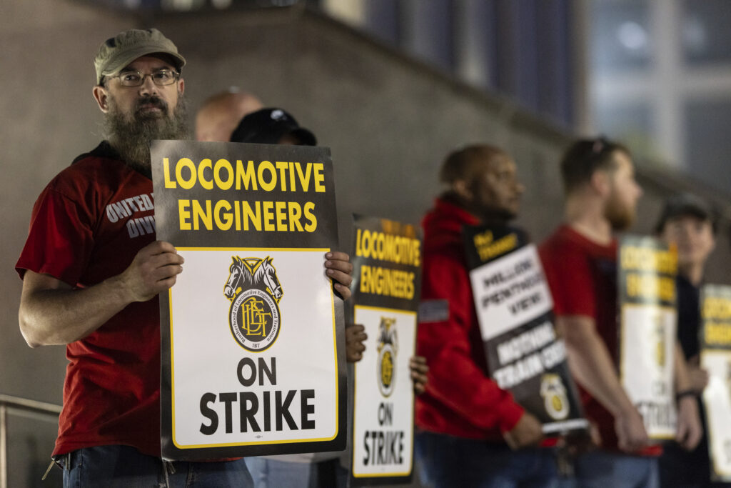 Union members from the Brotherhood of Locomotive Engineers and Trainmen form a picket line outside the NJ Transit Headquarters on Friday, May 16, 2025 in Newark, New Jersey.