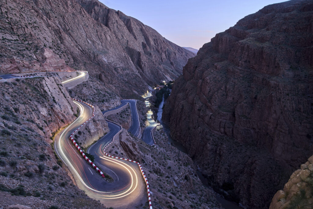 A long exposure photo shows vehicles driving through the Dades valley in the High Atlas mountains, in Morocco, Wednesday, May 7, 2025.