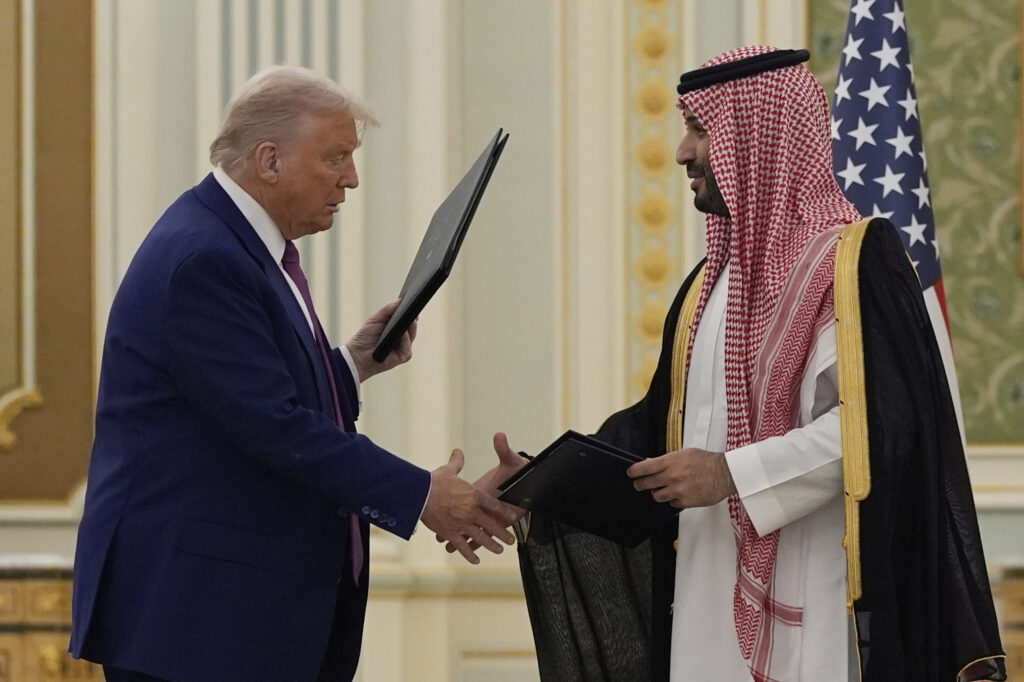 President Donald Trump and Saudi Crown Prince Mohammed bin Salman shake hands after exchanging documents during a signing ceremony at the Royal Palace in Riyadh, Saudi Arabia, Tuesday, May 13, 2025.