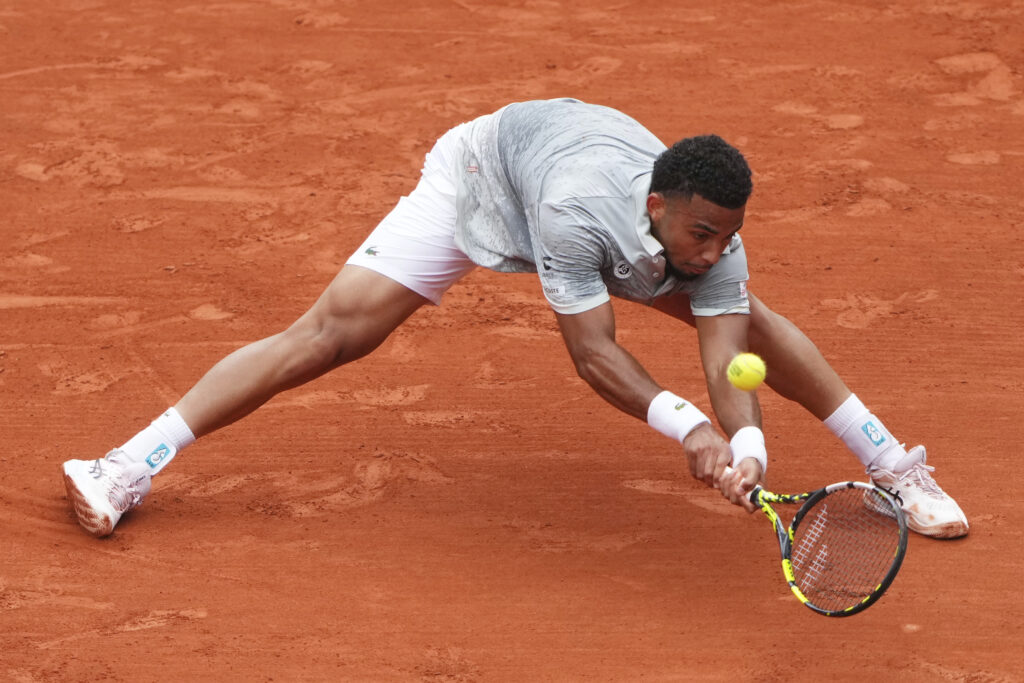 France's Arthur Fils reaches for the ball as he plays Chile's Nicolas Jarry during their first round match of the French Tennis Open, at the Roland-Garros stadium, in Paris, Monday, May 26, 2025.