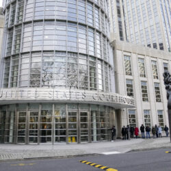 Individuals called for jury duty stand in line before entering Federal court in Brooklyn, Tuesday, Jan. 17, 2023, in New York. AP Photo/John Minchillo
