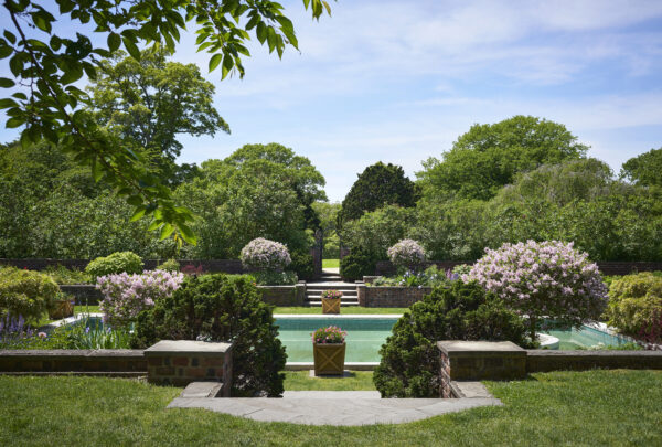 This image provided by Phaidon/Monacelli shows a springtime view of the Blue Pool Garden at Planting Fields State Historic Park in Oyster Bay, N.Y, as published in the book, "Planting Fields: A Place on Long Island," edited by Gina J. Wouters and Jerome E. Singerman. David Almeida via AP
