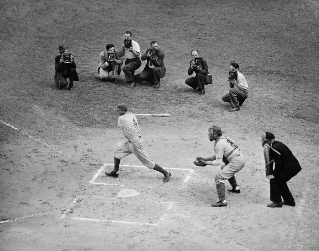 Two dozen former Dodgers stars met in a three inning exhibition at Ebbets Field, Sept. 22, 1940. It was played between games of the Brooklyn-Philadelphia double header. Zach Wheat is at bat, Hank Deberry is catcher and Tom Dunn is umpire. AP Photo