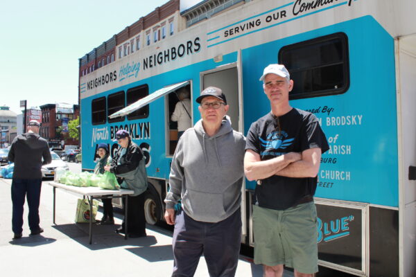 North Brooklyn Angels cofounders John Merz and Neil Sheehan pose next to one of the non-profit’s “Angelmobiles” on Wednesday, May 14, 2025. Photo by Owen Lavine