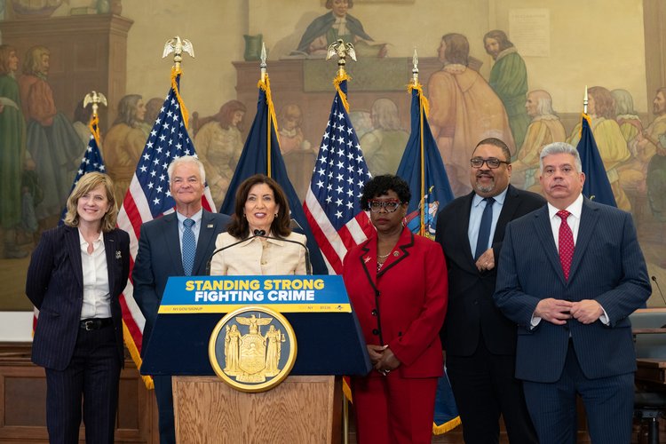 Governor Kathy Hochul was joined by Queens District Attorney Melinda Katz, Staten Island District Attorney Michael McMahon, Bronx District Attorney Darcel Clark, Manhattan District Attorney Alvin Bragg and Brooklyn District Attorney Eric Gonzalez to celebrate changes made to the state’s discovery laws on Wednesday. Photo via Governor Hochul’s Office