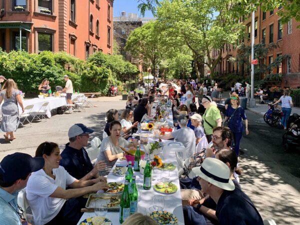 “The Longest Table” stretched an entire block along Remsen Street in Brooklyn Heights for a community potluck on Saturday, May 17. Photo: Mary Frost, Brooklyn Eagle