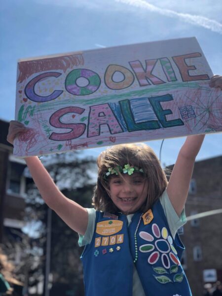 Ashleigh F. selling Girl Scout cookies when she was younger. Photos courtesy of Girl Scouts of America