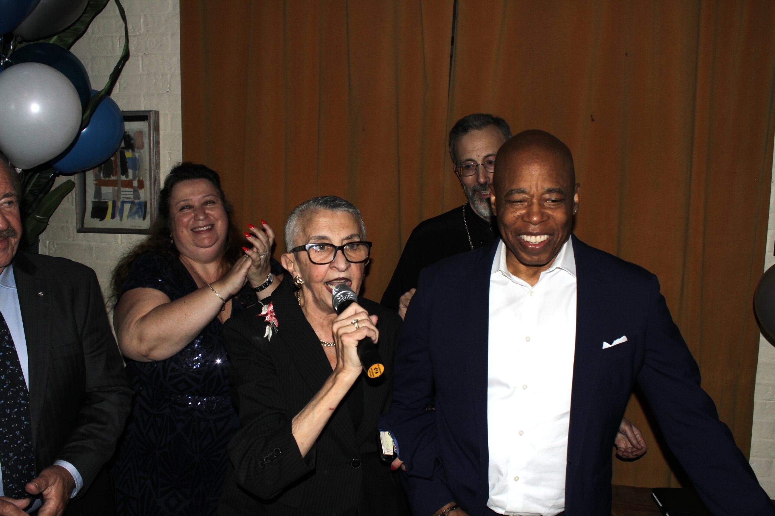 Zoe Koutsoupakis introducing New York City Mayor Eric Adams. Photo by Arthur De Gaeta