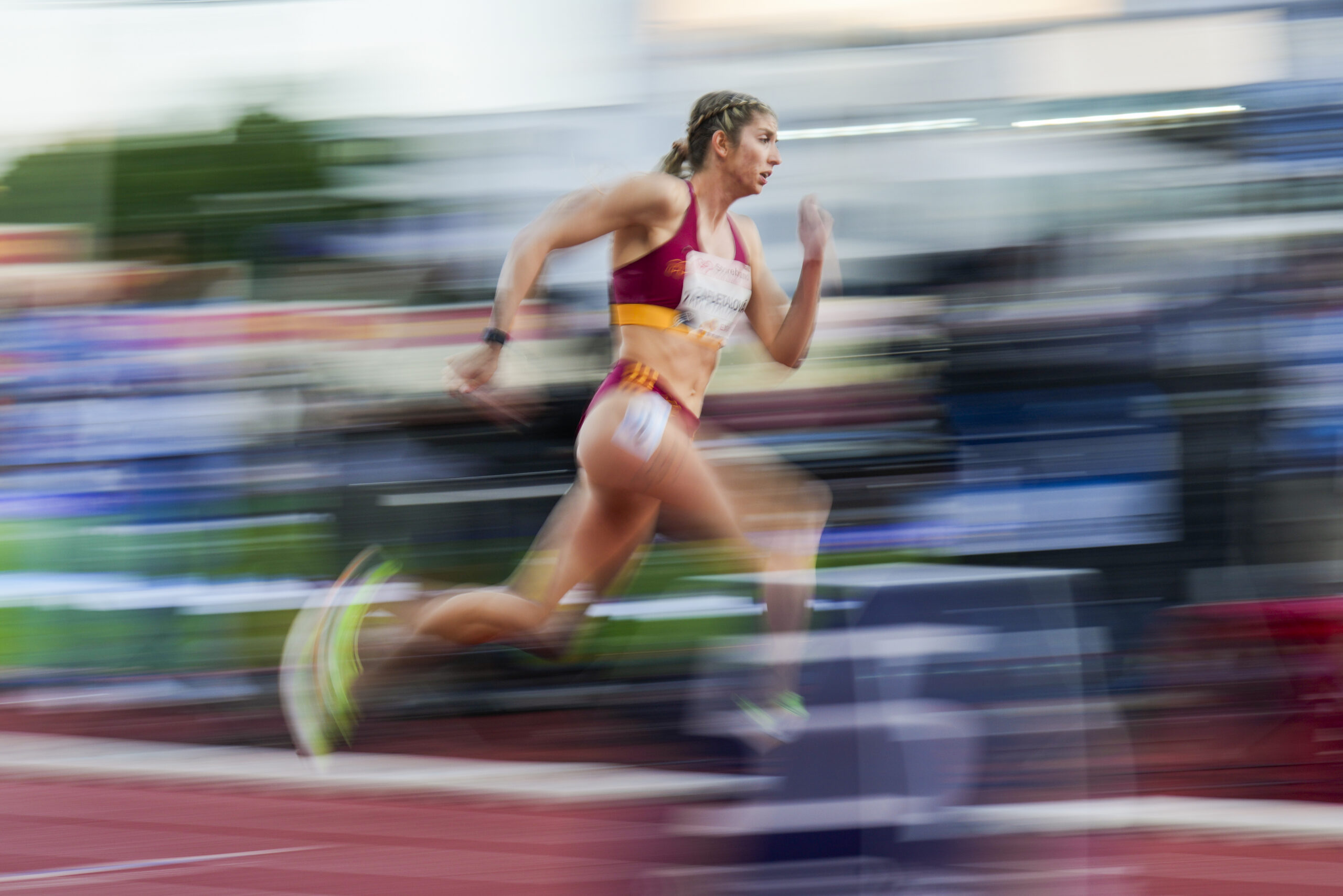 In this image taken with a slow shutter speed, Slovakia's Emma Zapletalová competes in the women's 400-meter hurdle race during the Bislett Games athletics meeting at Bislett Stadium in Oslo, Thursday, June 12, 2025.