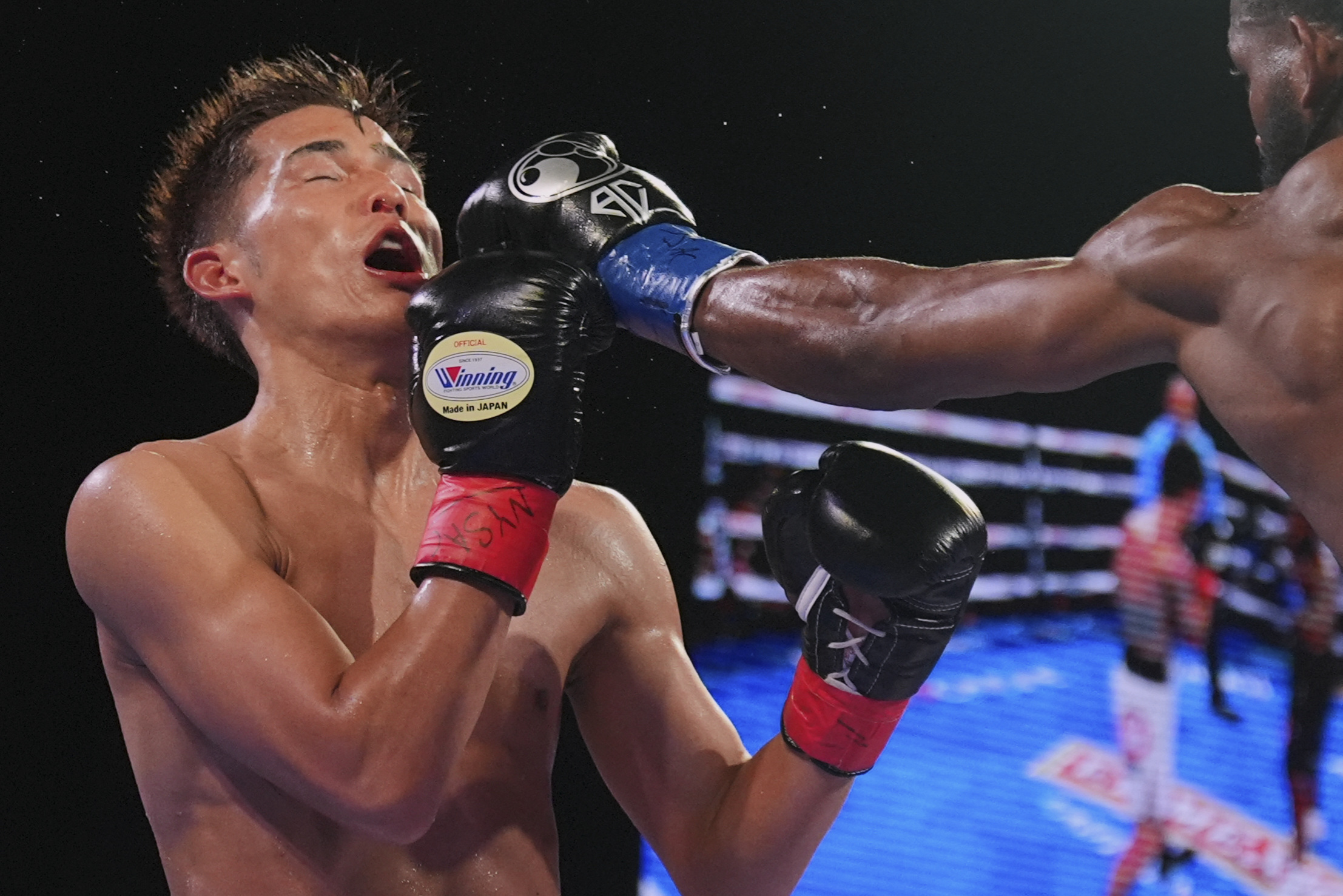 Cuba's Andy Cruz, right, punches Japan's Hironori Mishiro during the fourth round of a lightweight boxing match Saturday, June 14, 2025, in New York.