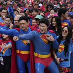 Superman fans dressed in costumes pose during an event as part of the first stop of the Superman World Tour in Pasig city, Philippines on Thursday June 19, 2025.