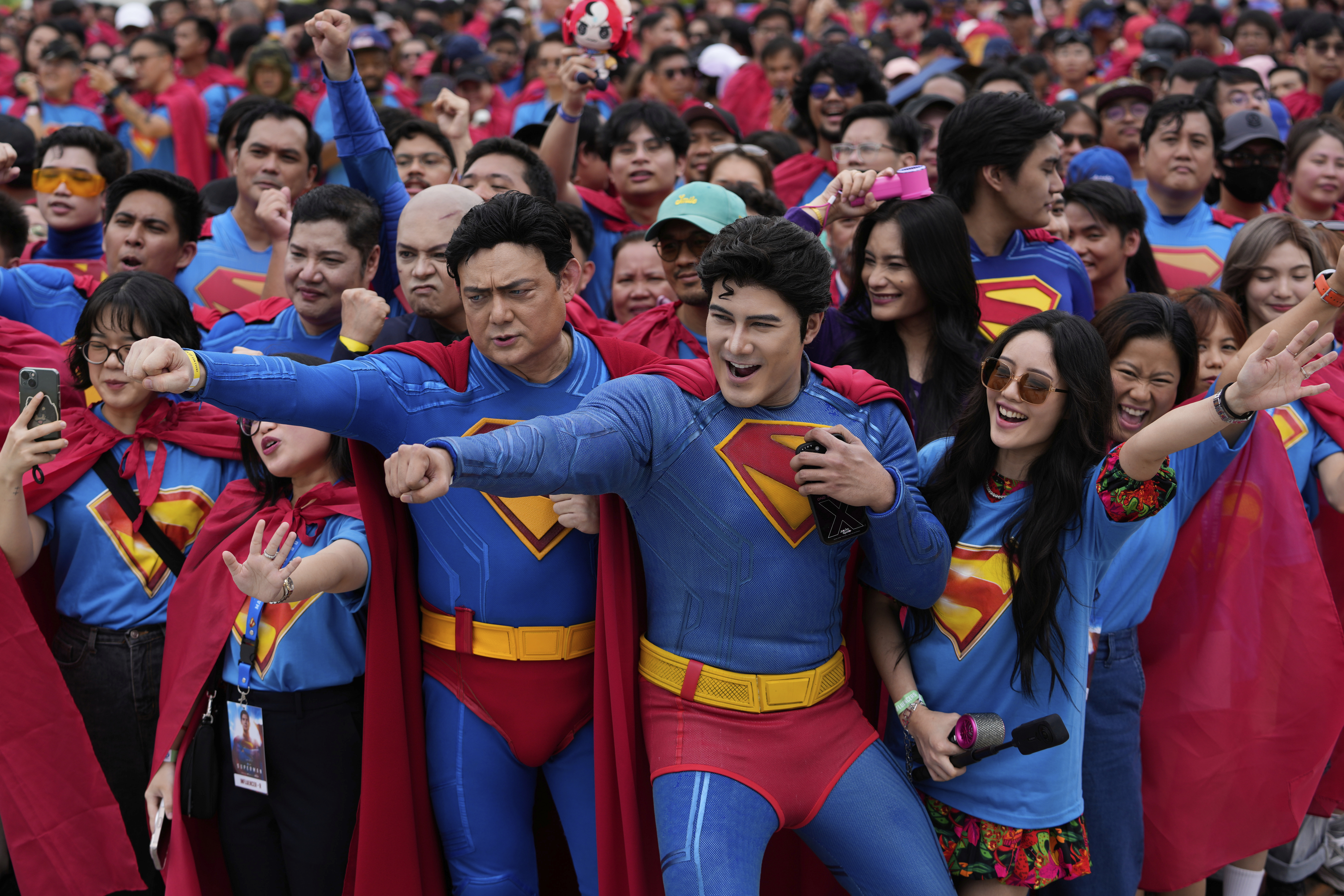 Superman fans dressed in costumes pose during an event as part of the first stop of the Superman World Tour in Pasig city, Philippines on Thursday June 19, 2025.