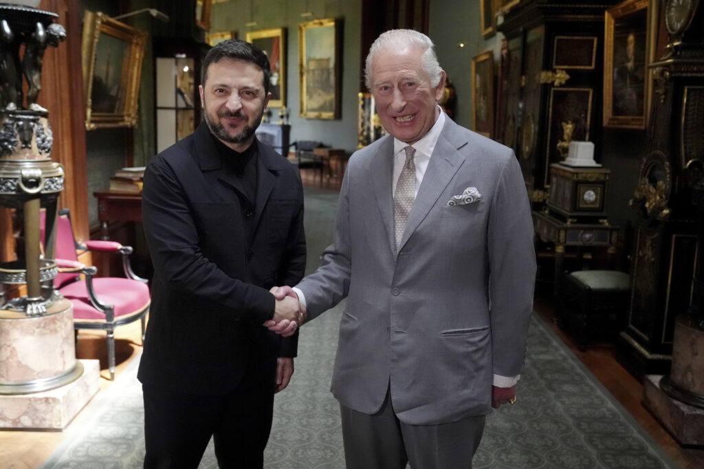 Britain's King Charles III, right, shakes hands with Ukrainian President Volodymyr Zelenskyy on the occasion of their private audience at Windsor Castle, England, Monday, June 23, 2025.