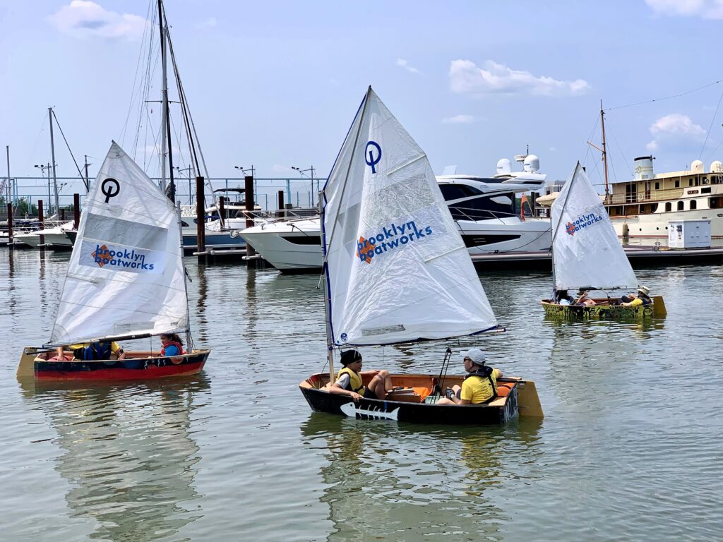 About 200 middle school students launched their hand-made sailboats at Brooklyn Bridge Marina on June 11. Photo: Mary Frost, Brooklyn Eagle