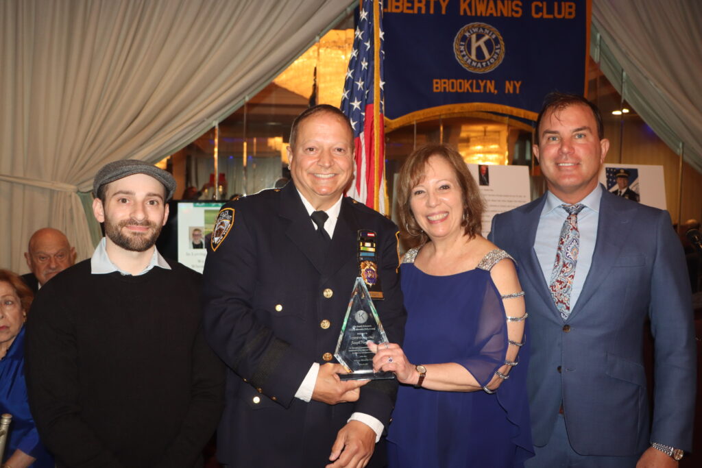 NYPD Deputy Chief Joseph Hayward holding his Frank Polemeni Liberty Kiwanis Civic Award alongside Karen Emma. Photo by Mario Belluomo