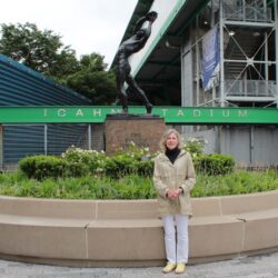 Pinky Keehner stands in front of the Discus Thrower statue, which was placed at the entrance of Icahn Stadium last April. Brooklyn Eagle photo by Owen Lavine