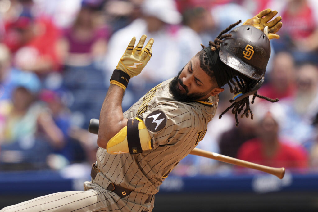 San Diego Padres' Fernando Tatis Jr. avoids a pitch from Philadelphia Phillies' Mick Abel during the second inning in the first baseball game of a doubleheader Wednesday, July 2, 2025, in Philadelphia.