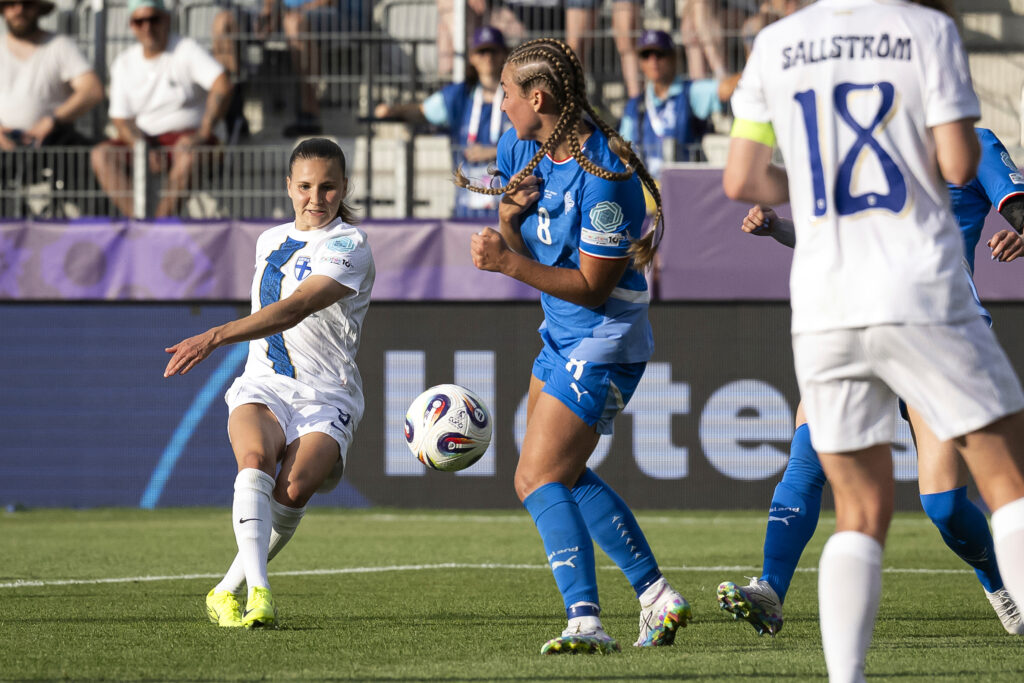 Finland 's Katariina Kosola, left, scores during the Euro 2025, group A, soccer match between Iceland and Finland at Arena Thun in Thun, Switzerland, Wednesday, July 2, 2025.
