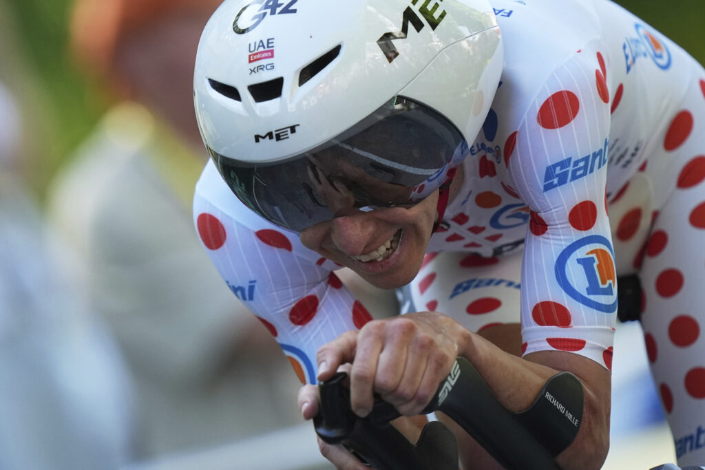 Slovenia's Tadej Pogacar wearing the best climber's dotted jersey crosses the finish line during the fifth stage of the Tour de France cycling race, an indivdual time-trial over 33 kilometers (20.5 miles) with start and finish in Caen, France, Wednesday, July 9, 2025.