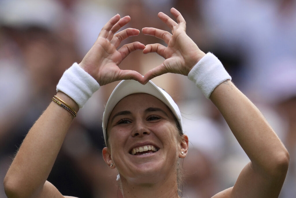 Switzerland's Belinda Bencic celebrates after beating Mirra Andreeva of Russia in a quarterfinal women's singles match between at the Wimbledon Tennis Championships in London, Wednesday, July 9, 2025.
