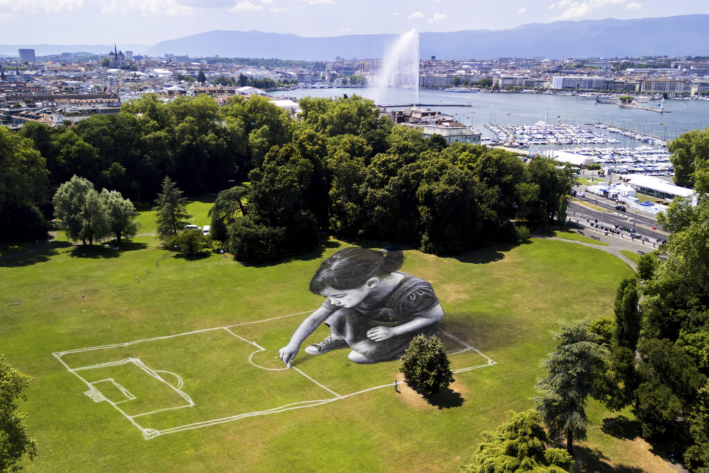 A land art painting titled "Le terrain des possibles" created by Swiss French artist SAYPE in the parc La Grange to mark the upcoming Euro 2025 soccer tournament, in Geneva, Switzerland, Tuesday, July 1, 2025.