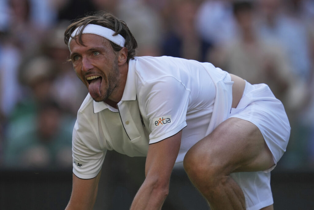 Arthur Rinderknech of France celebrates after beating Alexander Zverev of Germany in their first round men's singles match at the Wimbledon Tennis Championships in London, Tuesday, July 1, 2025.