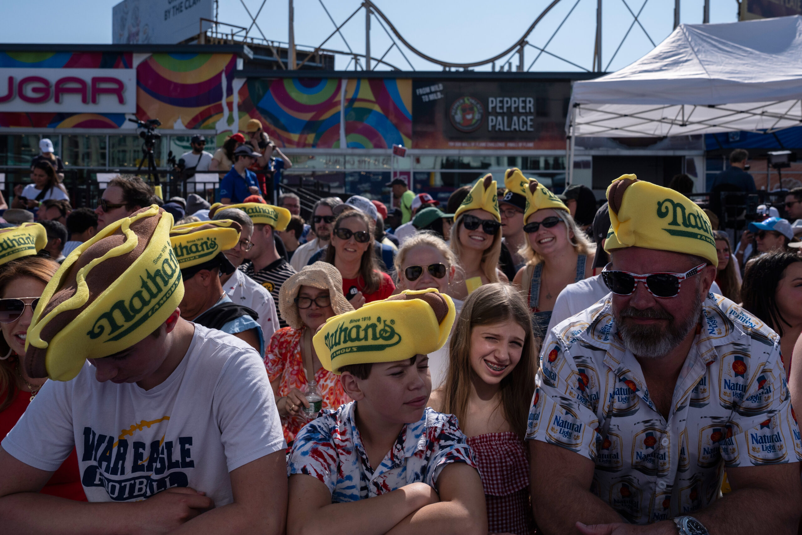 People wait for the 2025 Nathan's Famous Fourth of July hot dog eating contest in Coney Island, Thursday, July 4, 2025. AP Photo/Yuki Iwamura