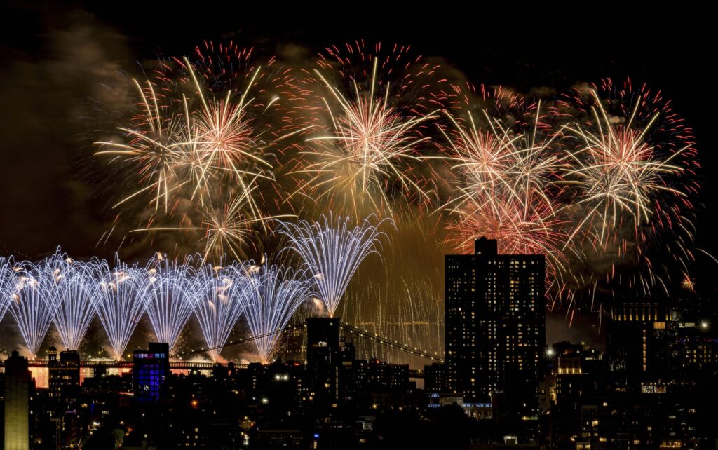 Fireworks explode over the East River and Brooklyn Bridge during the Macy's 4th of July Fireworks Show on July 4, 2025 in New York. Photo: Evan Agostini/Invision/AP