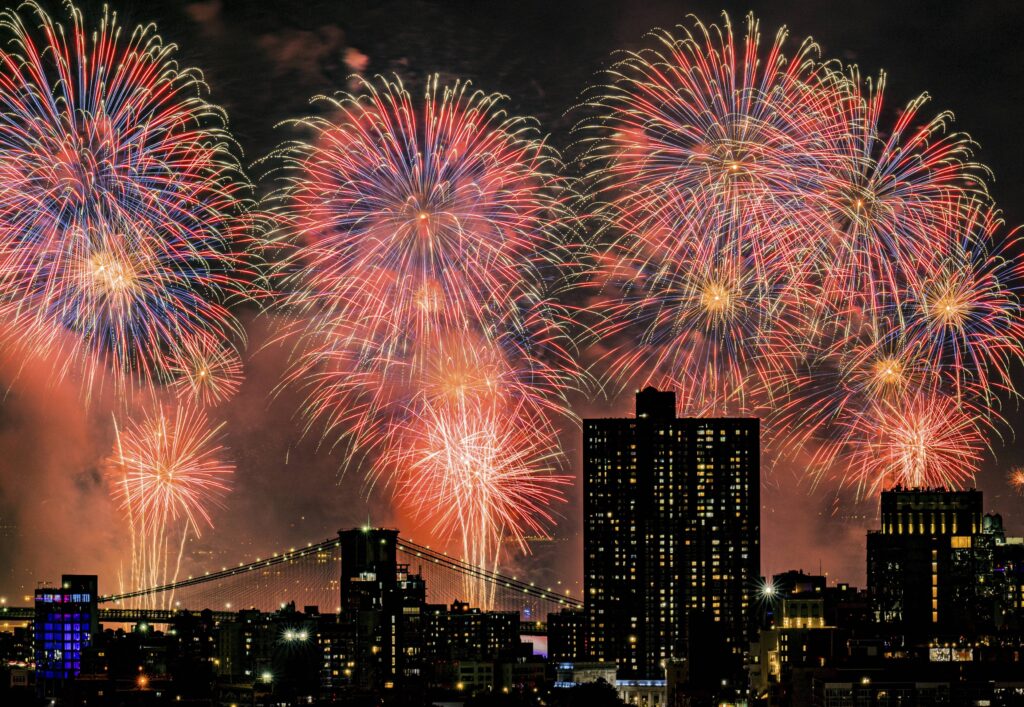 Fireworks explode over the East River and Brooklyn Bridge during the Macy's 4th of July Fireworks Show on July 4, 2025 in New York. Photo: Evan Agostini/Invision/AP