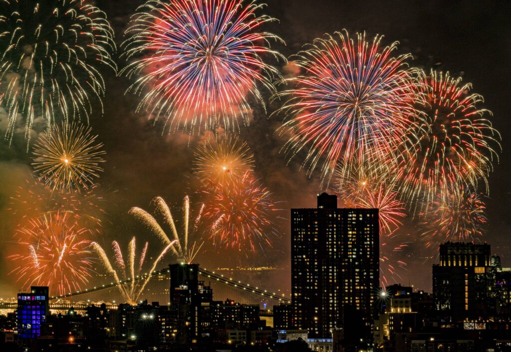 Fireworks explode over the East River and Brooklyn Bridge during the Macy's 4th of July Fireworks Show on July 4, 2025 in New York. Photo: Evan Agostini/Invision/AP