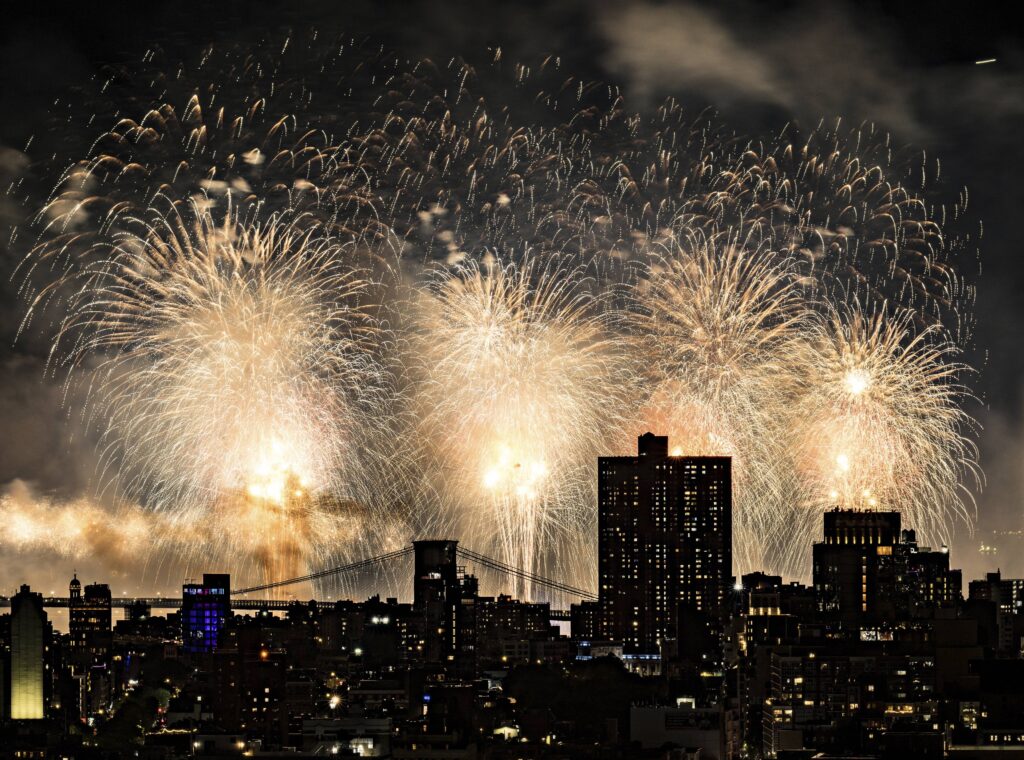 Fireworks explode over the East River and Brooklyn Bridge during the Macy's 4th of July Fireworks Show on July 4, 2025 in New York. Photo: Evan Agostini/Invision/AP